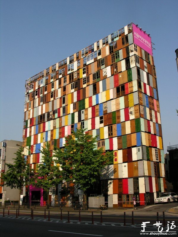 A building decorated with old doors