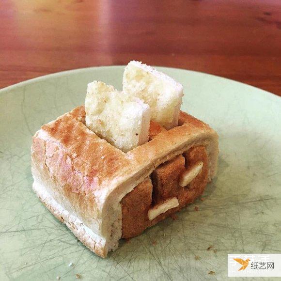 The bread carvings made by the loving father make his allergic daughter very happy to eat them