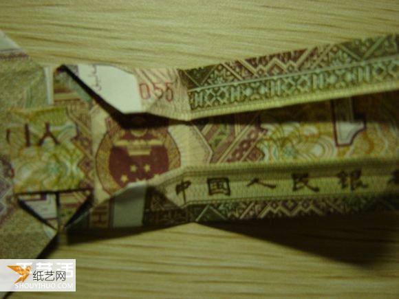 Detailed illustration of how to use the dollar bill folding paper camera