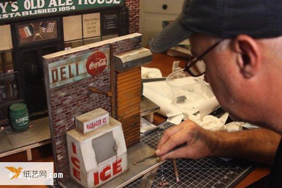 A handmade miniature model that recreates the traditional New York style shop street scene.