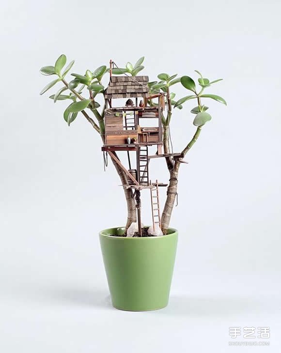 An exquisite Lilliputian-like miniature architectural treehouse model on a potted plant