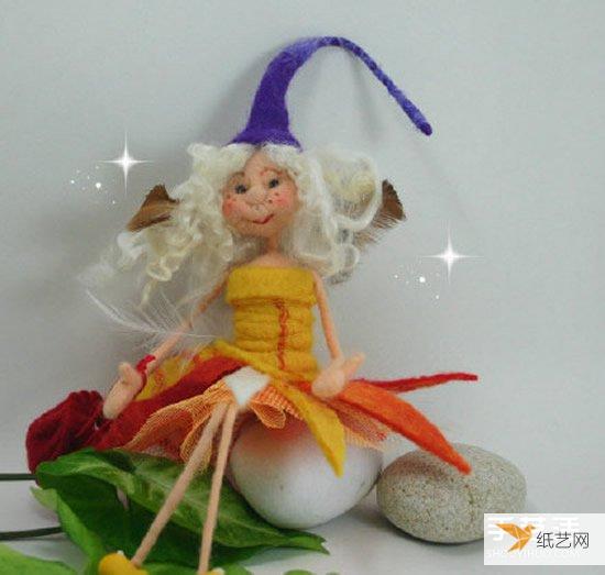 A particularly beautiful cartoon-style picture of a handmade wool felt girl doll