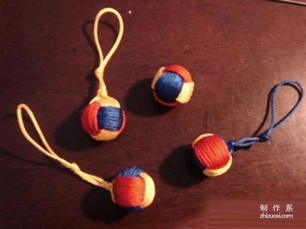 Colored ropes are hand-woven to make exquisite and beautiful three-color ball hanging ornaments.