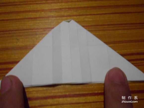 Real-life origami tutorial illustration of rose origami crane