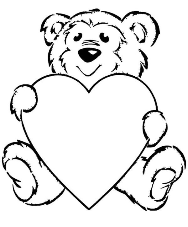 Teddy bear holding heart