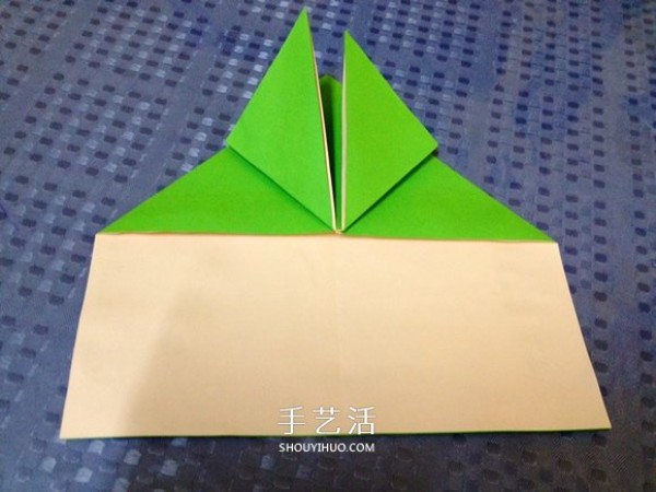 Detailed step-by-step illustration of a simple origami frog