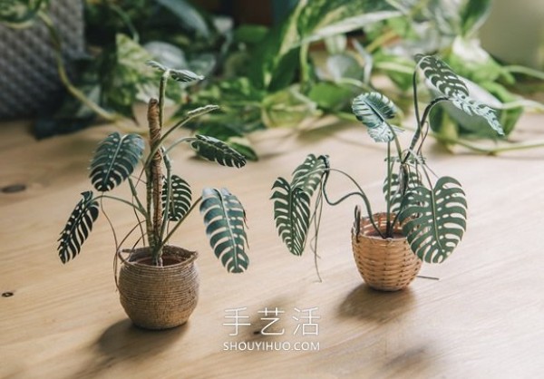 Amazing handmade paper potted plants that can be held between two fingers