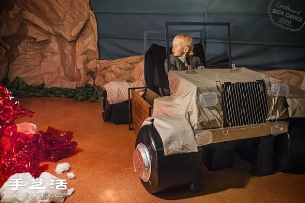 The role-playing time of a family of three in a homemade movie scene from a cardboard box