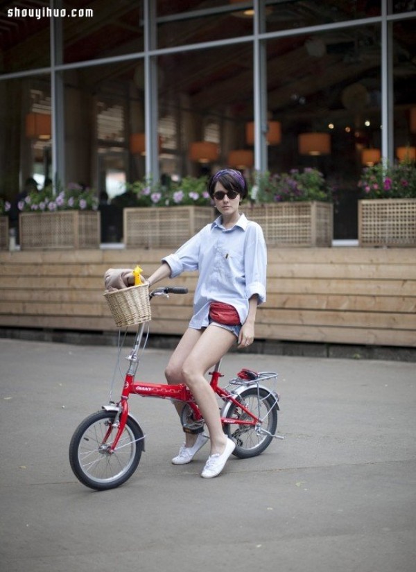 Moscows stylish bicycle girl travels elegantly in the urban area