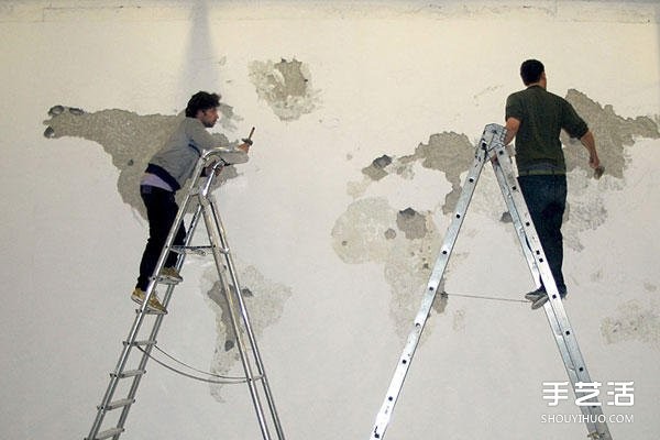 On a blank wall, DIY on a blank wall and tap on a whole side of the world map