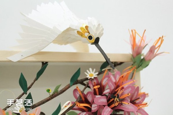 Realistic pictures of handmade paper birds put you in a world of singing birds and fragrant flowers