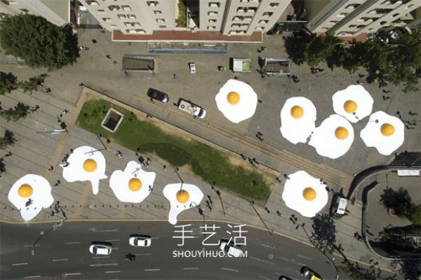 Huge poached eggs! 3 meters wide and 1.5 meters high egg installation art