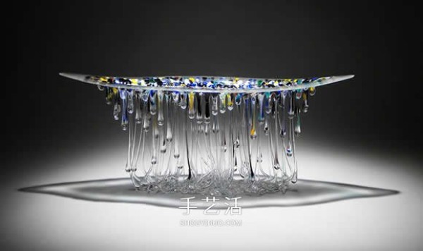 The dripping stained glass sculpture transforms into a jellyfish-like splendid gesture