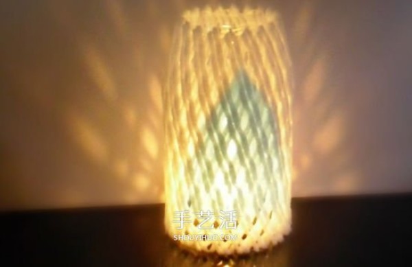 Using waste fruit net sets and pairing them with mineral water bottles to make lantern lighting