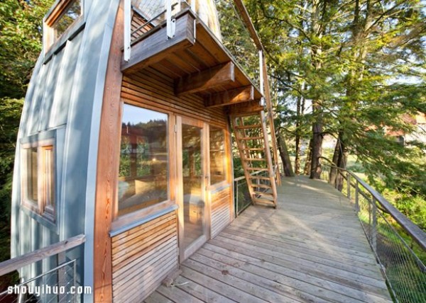 An old thatched hut transformed into a strange tree house standing in a lake