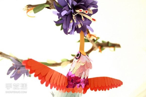 Realistic pictures of handmade paper birds put you in a world of singing birds and fragrant flowers