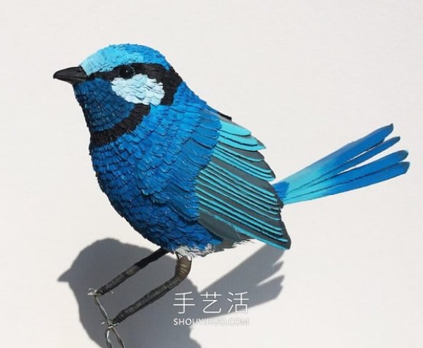 Realistic paper bird sculpture that looks like a photo