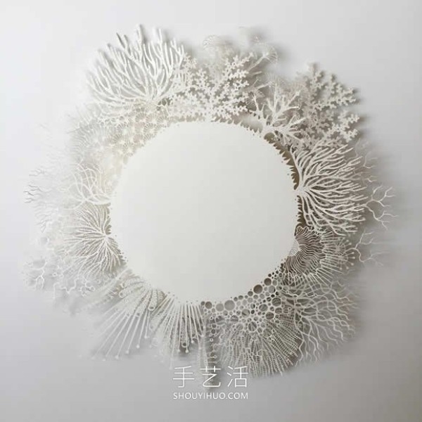 Intricate hand-cut paper sculptures that mimic microorganisms