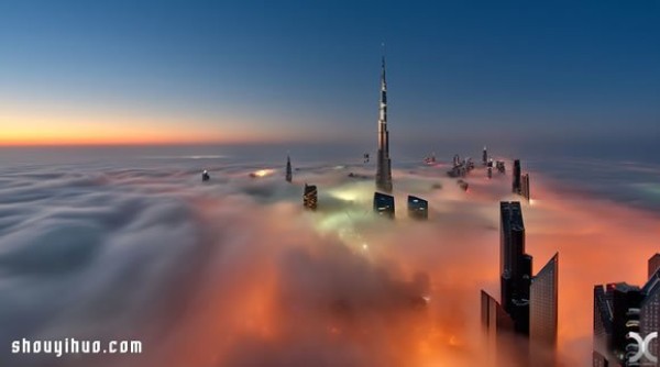 Photography of the city of Dubai on high buildings reveals the city of sky above the clouds and mist