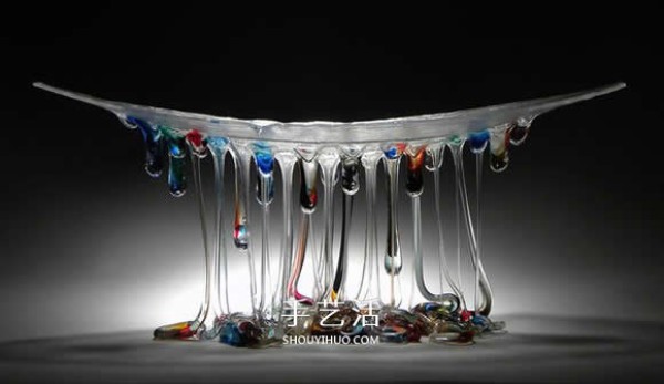 The dripping stained glass sculpture transforms into a jellyfish-like splendid gesture