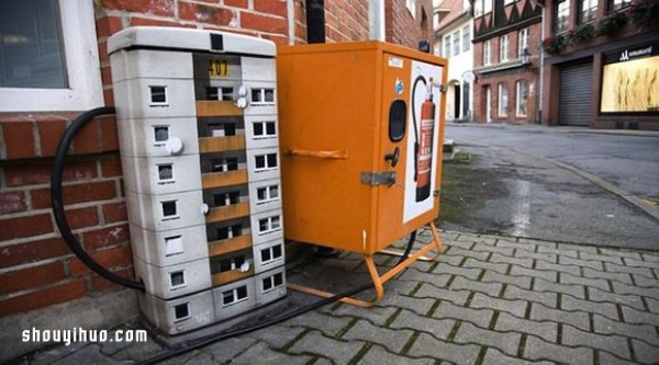 The cement piers and electrical boxes are transformed into houses with mini buildings and graffiti to beautify the environment