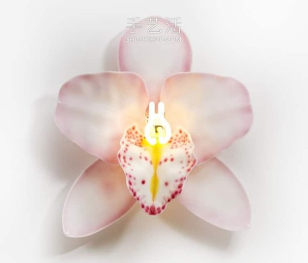 Glowing orchid sculpture artwork made of glass