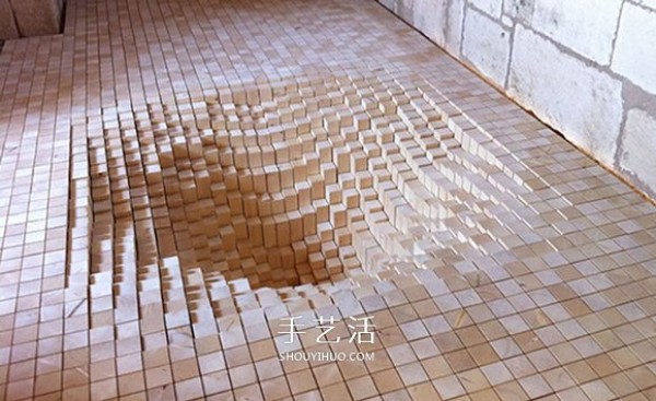 3000 wooden blocks to make a "trap" that swallows the floor