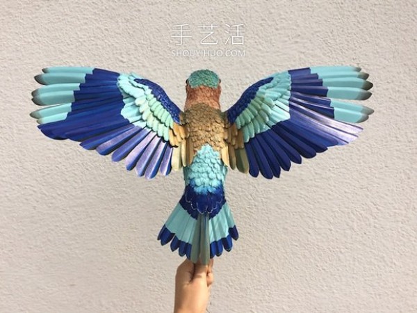 Realistic paper bird sculpture that looks like a photo