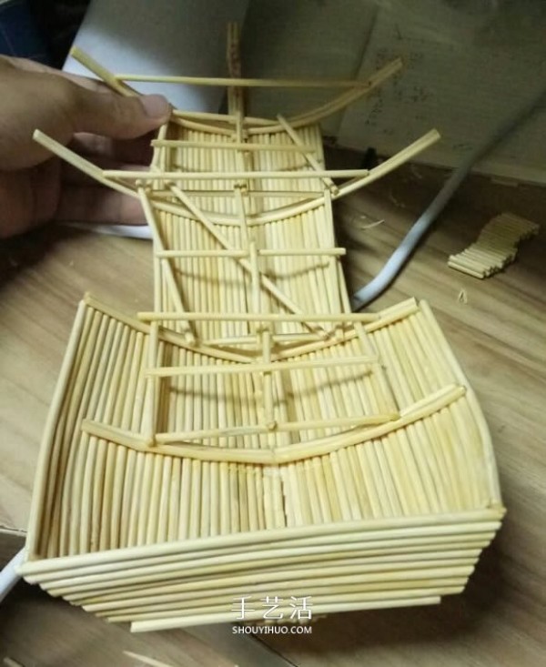 The ancient warship model is hand-made with disposable chopsticks