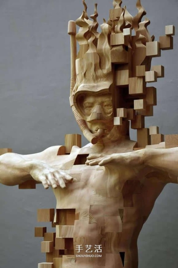 The wooden man is pixelated! The combination of traditional wood carving and digital elements