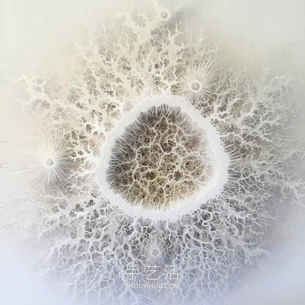 Intricate hand-cut paper sculptures that mimic microorganisms