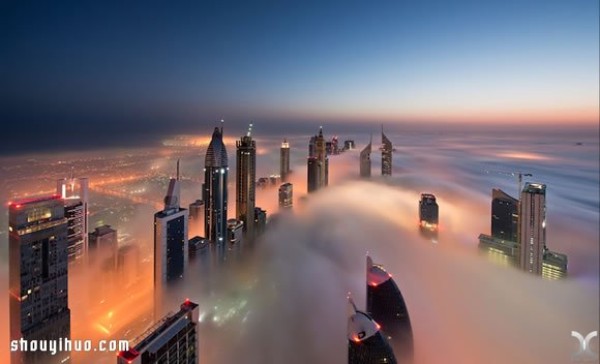 Photography of the city of Dubai on high buildings reveals the city of sky above the clouds and mist