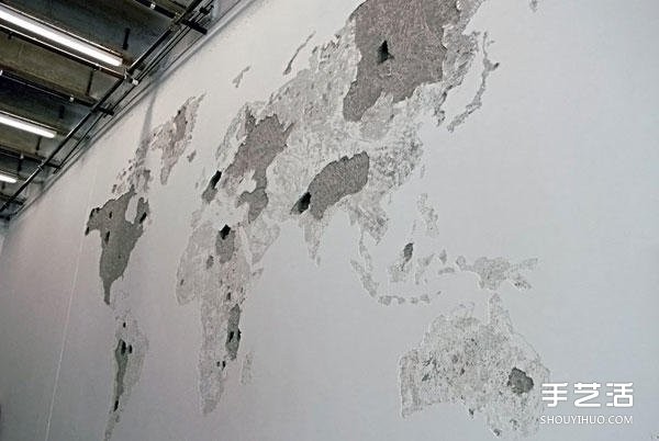 On a blank wall, DIY on a blank wall and tap on a whole side of the world map