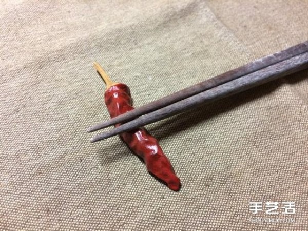 Its so similar! A small wooden carving of dried fish that accidentally broke its teeth