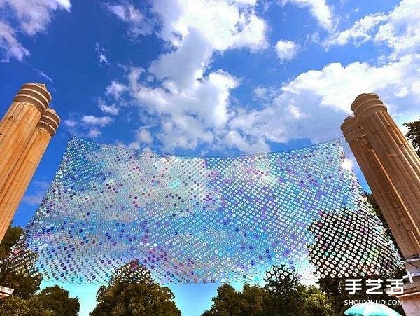 A giant rainbow curtain made of six thousand discarded CDs