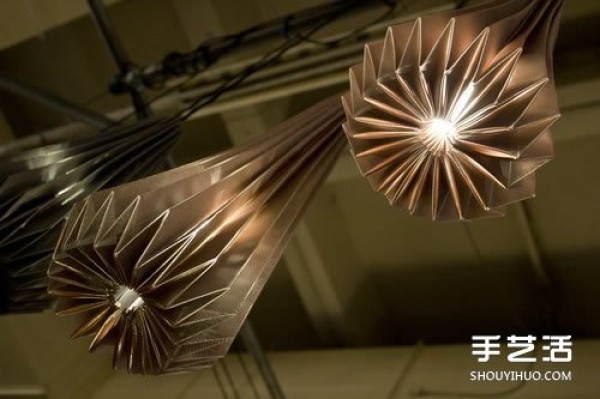 The New London Origami Queen creates artistic origami for three-dimensional lamps and furniture