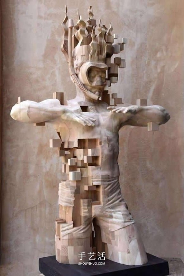 The wooden man is pixelated! The combination of traditional wood carving and digital elements