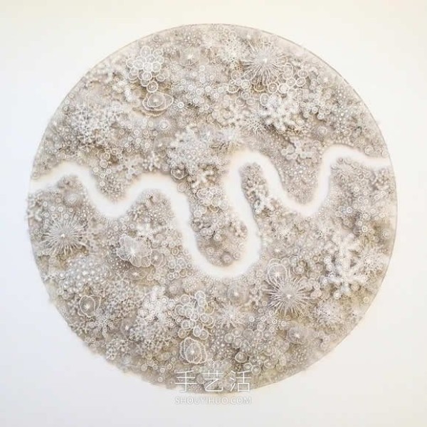 Intricate hand-cut paper sculptures that mimic microorganisms