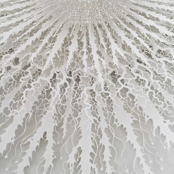 Intricate hand-cut paper sculptures that mimic microorganisms