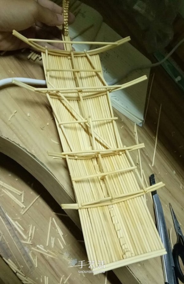 The ancient warship model is hand-made with disposable chopsticks