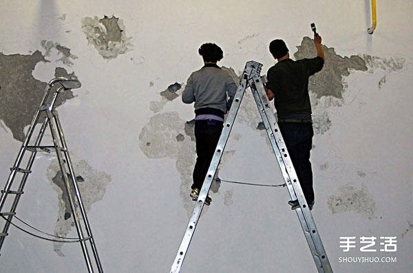 On a blank wall, DIY on a blank wall and tap on a whole side of the world map