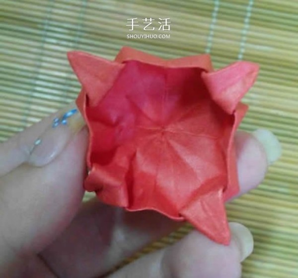 Illustration of the origami method of a lotus that is about to fully bloom