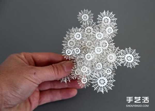 Three-dimensional paper sculptures inspired by bacteria, crystals, etc.