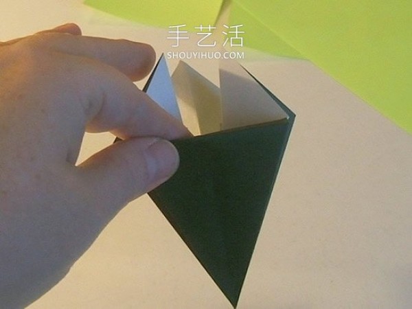 Detailed step-by-step diagram of how to fold a simple origami three-dimensional Christmas tree