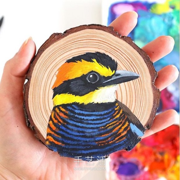 The artist spent 100 days painting 100 species of birds on wood chips