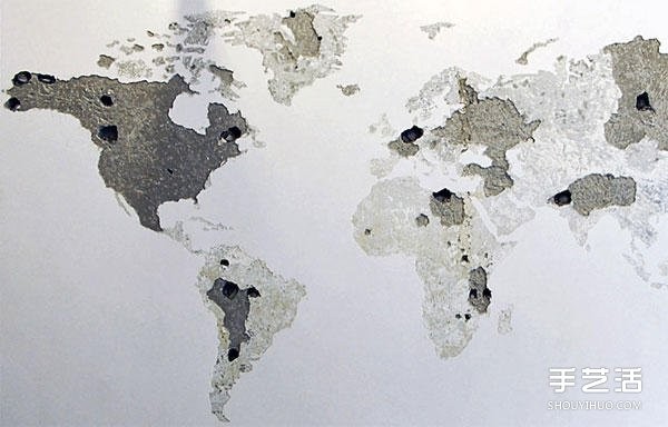 On a blank wall, DIY on a blank wall and tap on a whole side of the world map