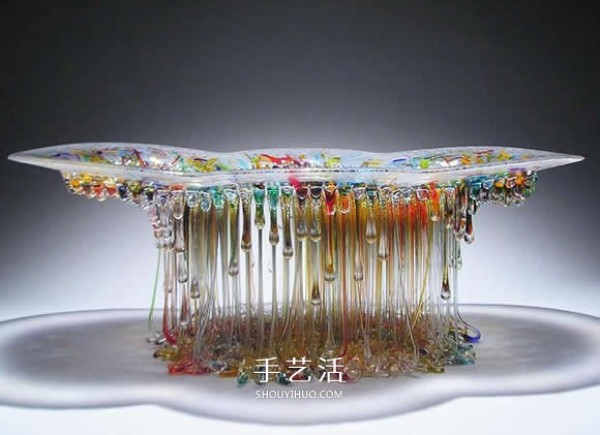 The dripping stained glass sculpture transforms into a jellyfish-like splendid gesture