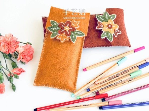 Tutorial on cutting two pieces of felt cloth and sewing on a homemade pencil case with decorative patterns