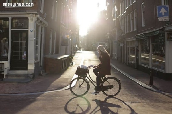 Moscows stylish bicycle girl travels elegantly through the urban area