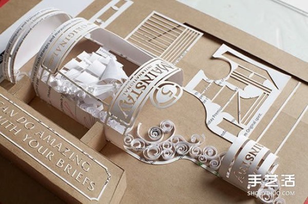 Exquisite paper sculptures create an overturned vodka bottle